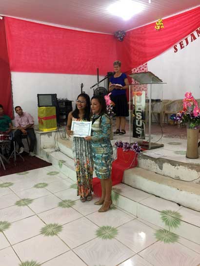 Tacila was so proud to give each teacher their certificate! - - - - - Tacila estava tão orgulhosa de entregar um certificado a cada professor!